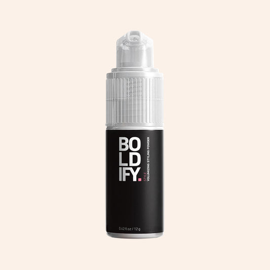 A container of volumizing styling powder with a pump dispenser, BOLDIFY